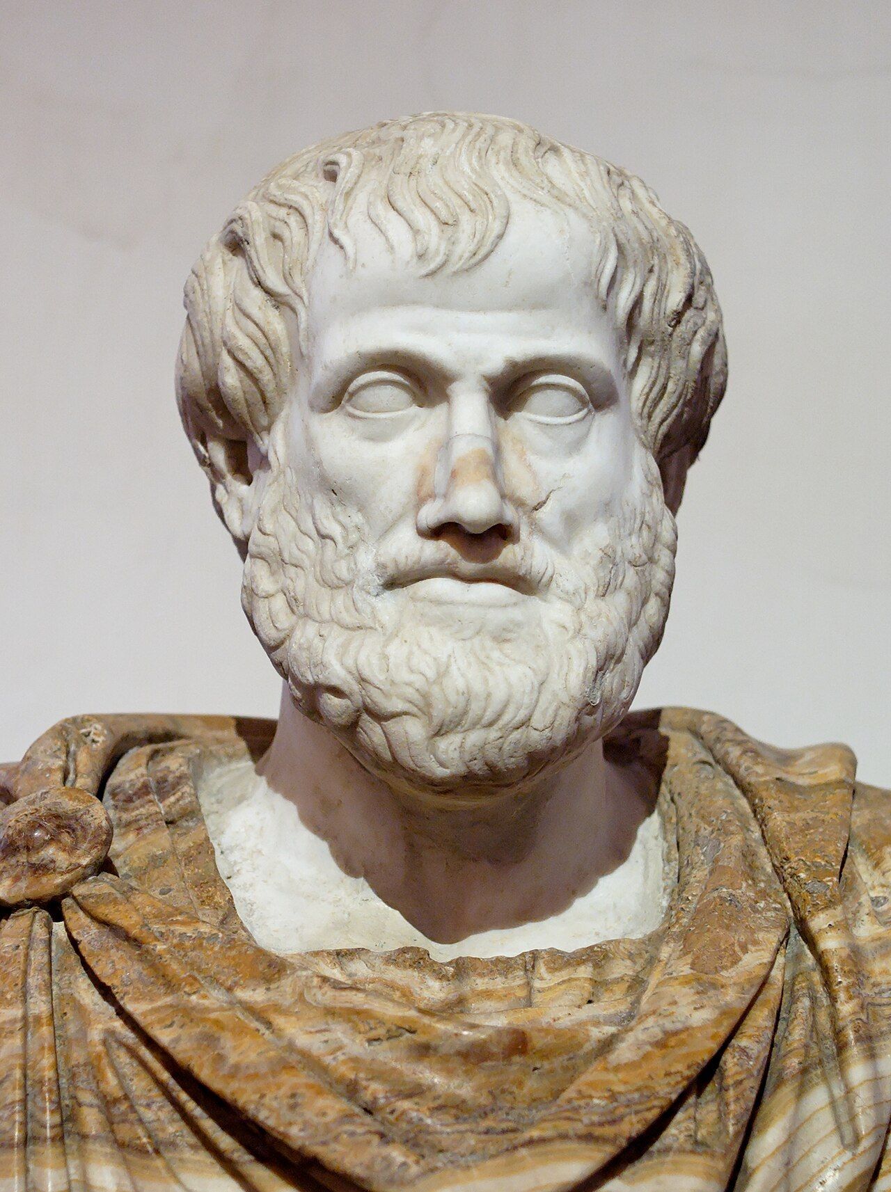 Marble bust of Aristotle, a Roman copy after a Greek bronze original, showing a bearded man with short curled hair