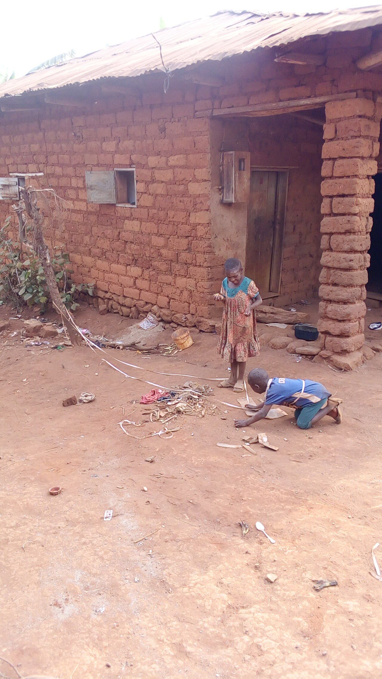 A group of school-age children skipping rope together outdoors