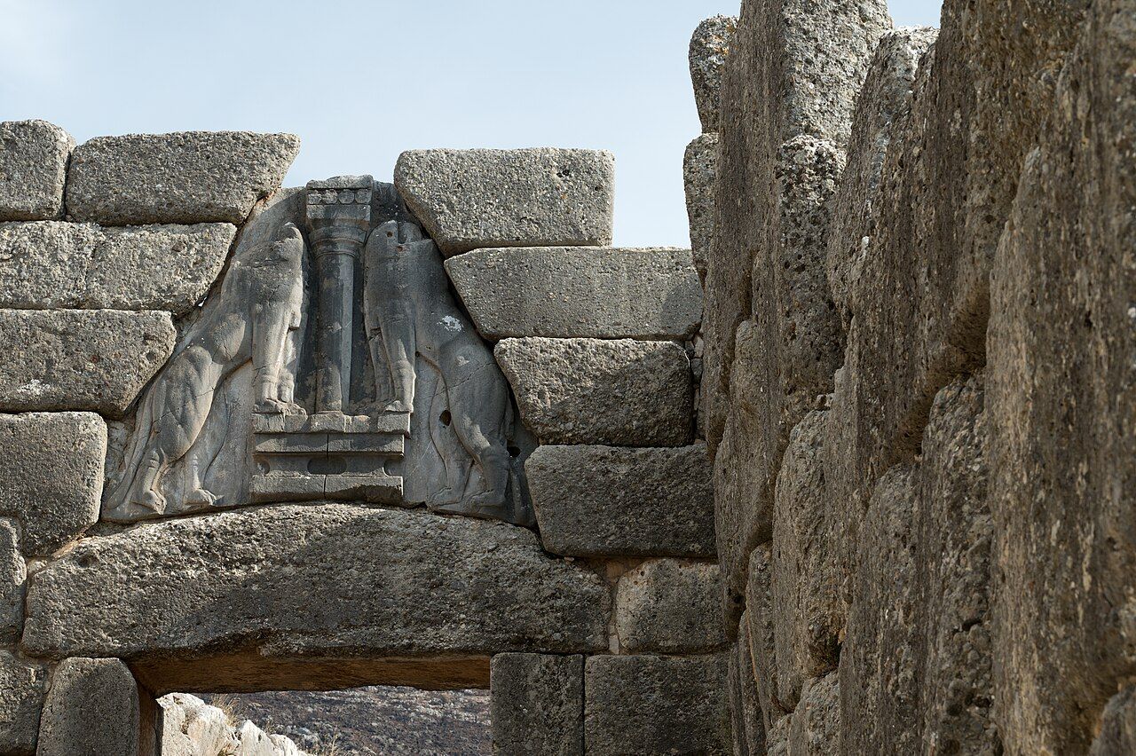 The Lion Gate at Mycenae, a massive corbelled stone entrance topped by two carved lionesses flanking a column