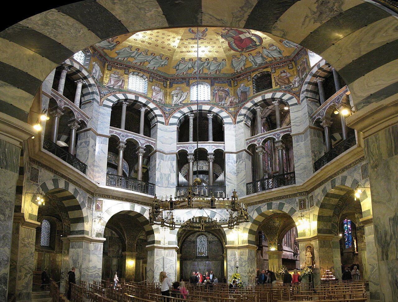 The Palatine Chapel at Aachen, consecrated about 805, borrowed its octagon from San Vitale in Ravenna as a deliberate claim to Roman and imperial inheritance.